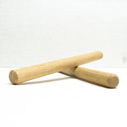 Two white oak double chamfer pegs
