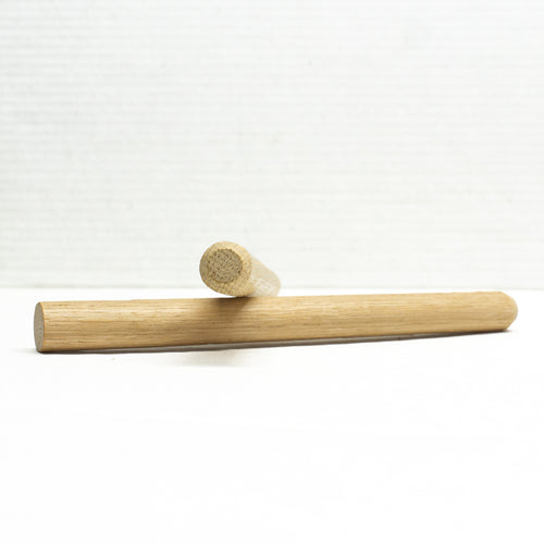 Two single chamfer white oak pegs 